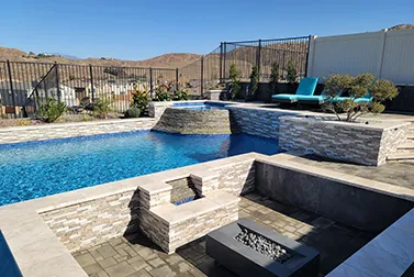Luxury backyard pool with custom spa features and high-end outdoor living design